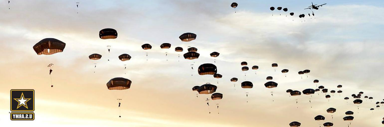 Paratroopers exit a C-130 aircraft.