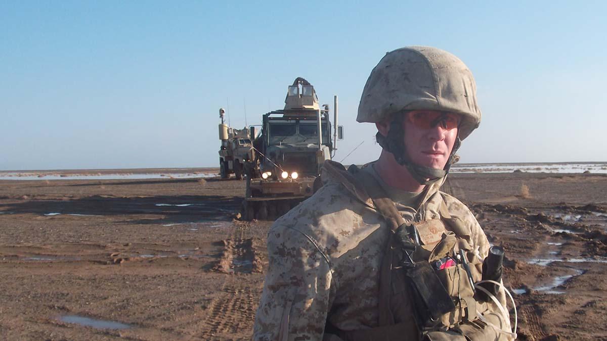 SSgt Michael Clark with a truck in the background